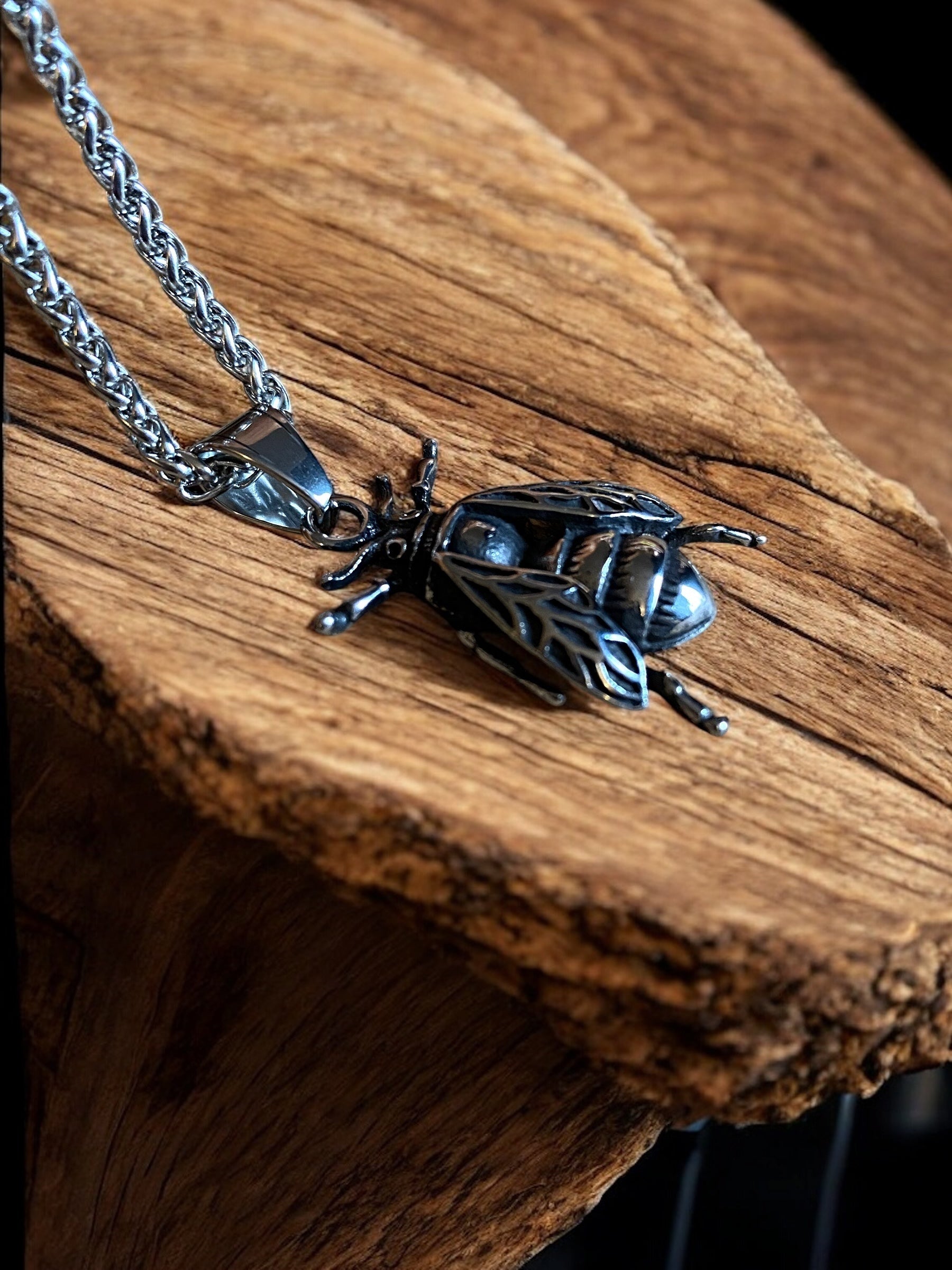 Close up view of viking fly pendant necklace.