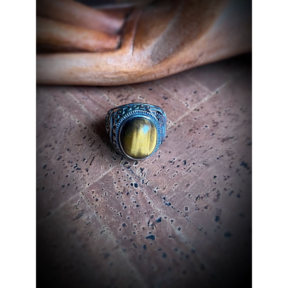 Close-up of the Viking Mammen Pearl ring on a wooden tabletop
